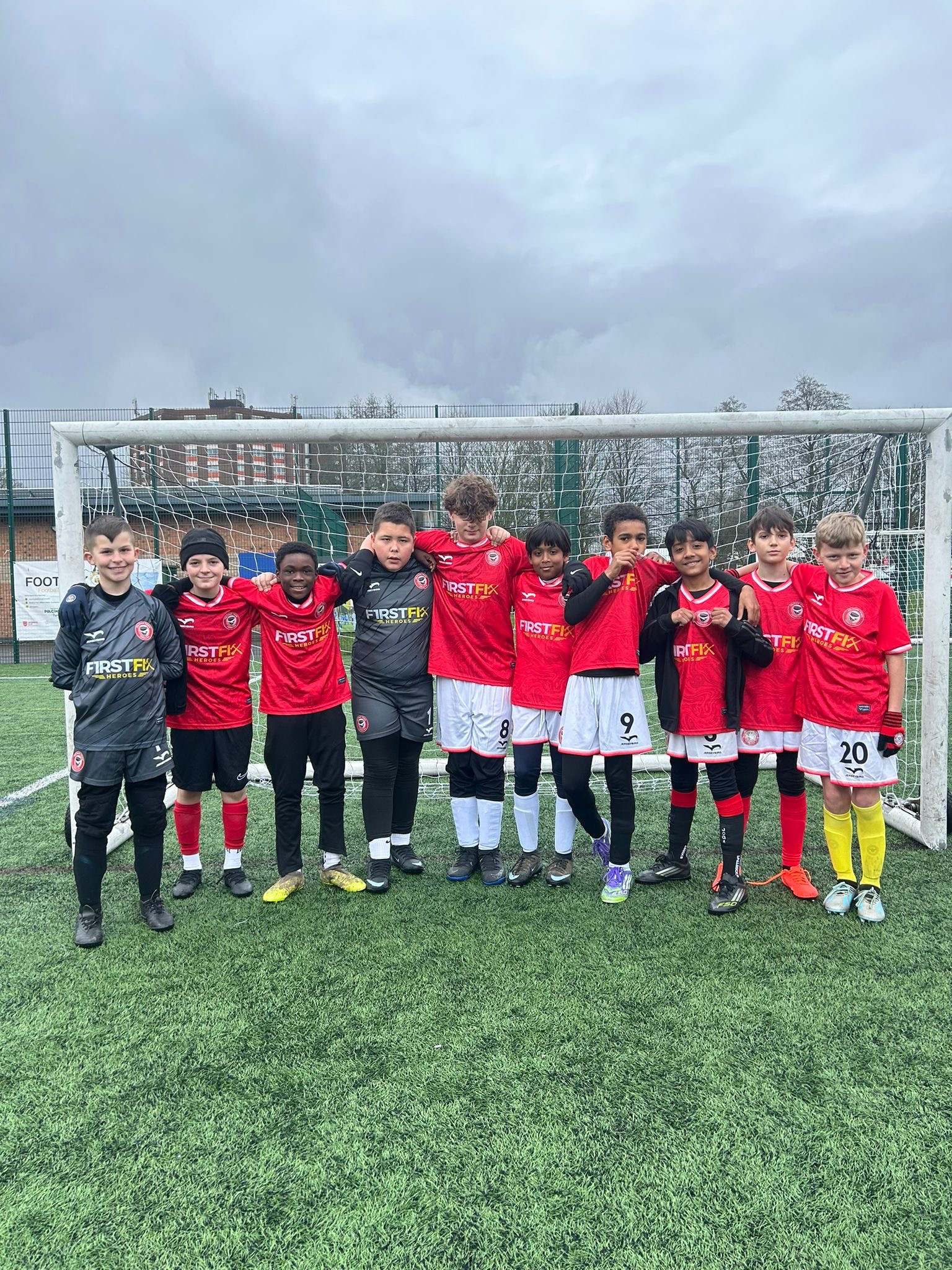 Feltham Town FC squad standing on the pitch