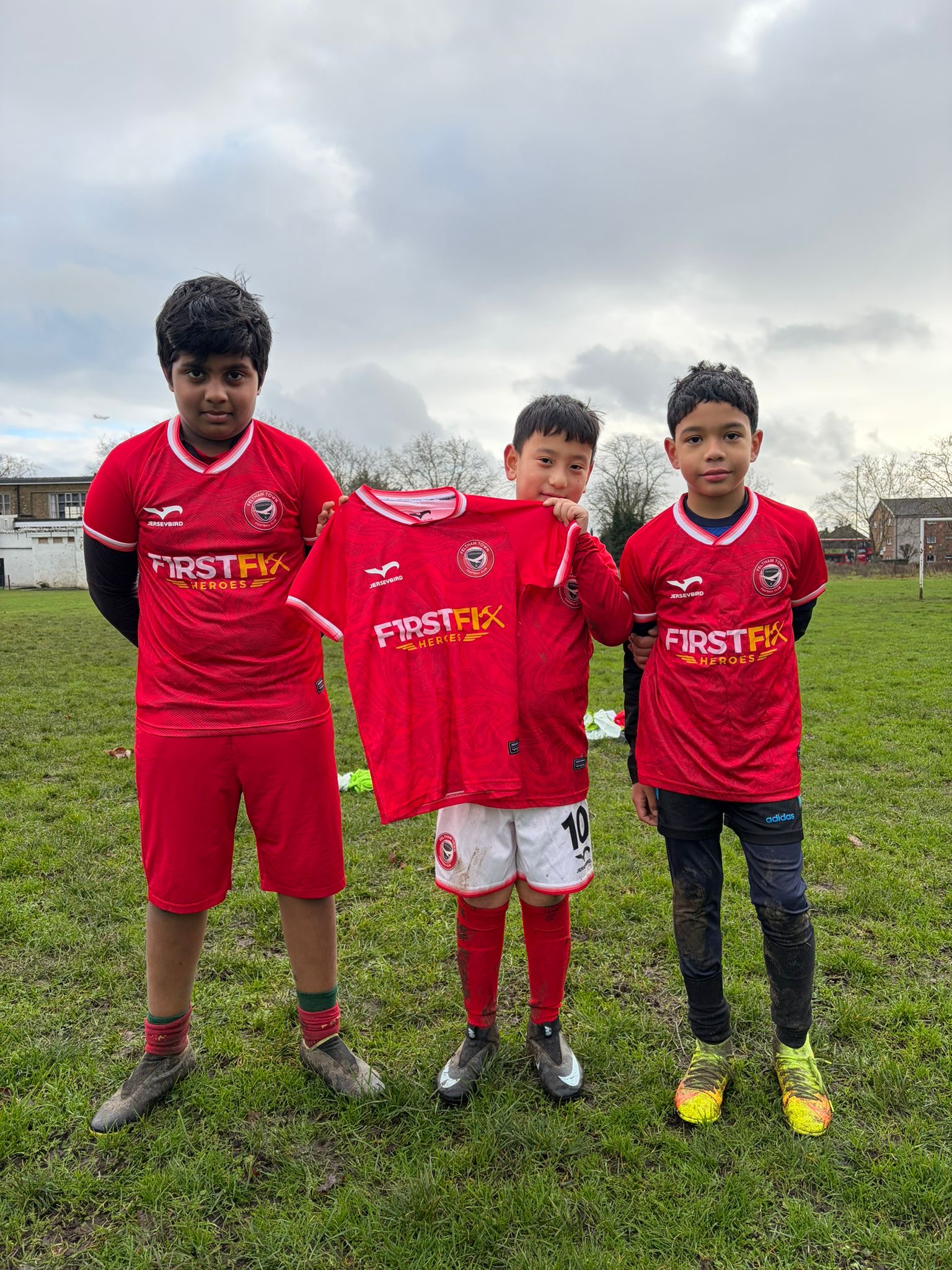 Feltham Town FC players celebrating together