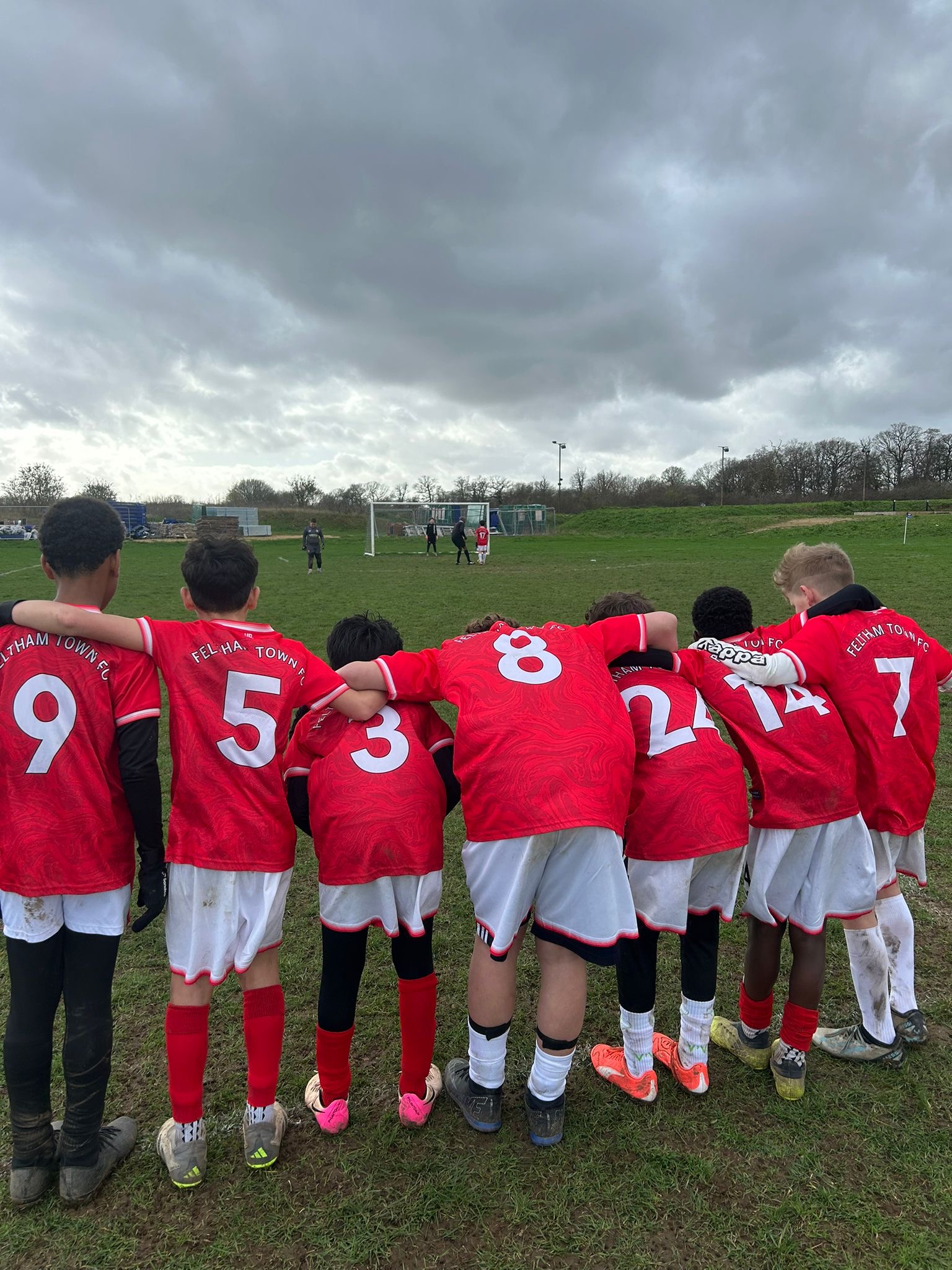 Feltham Town FC teammates smiling off the pitch