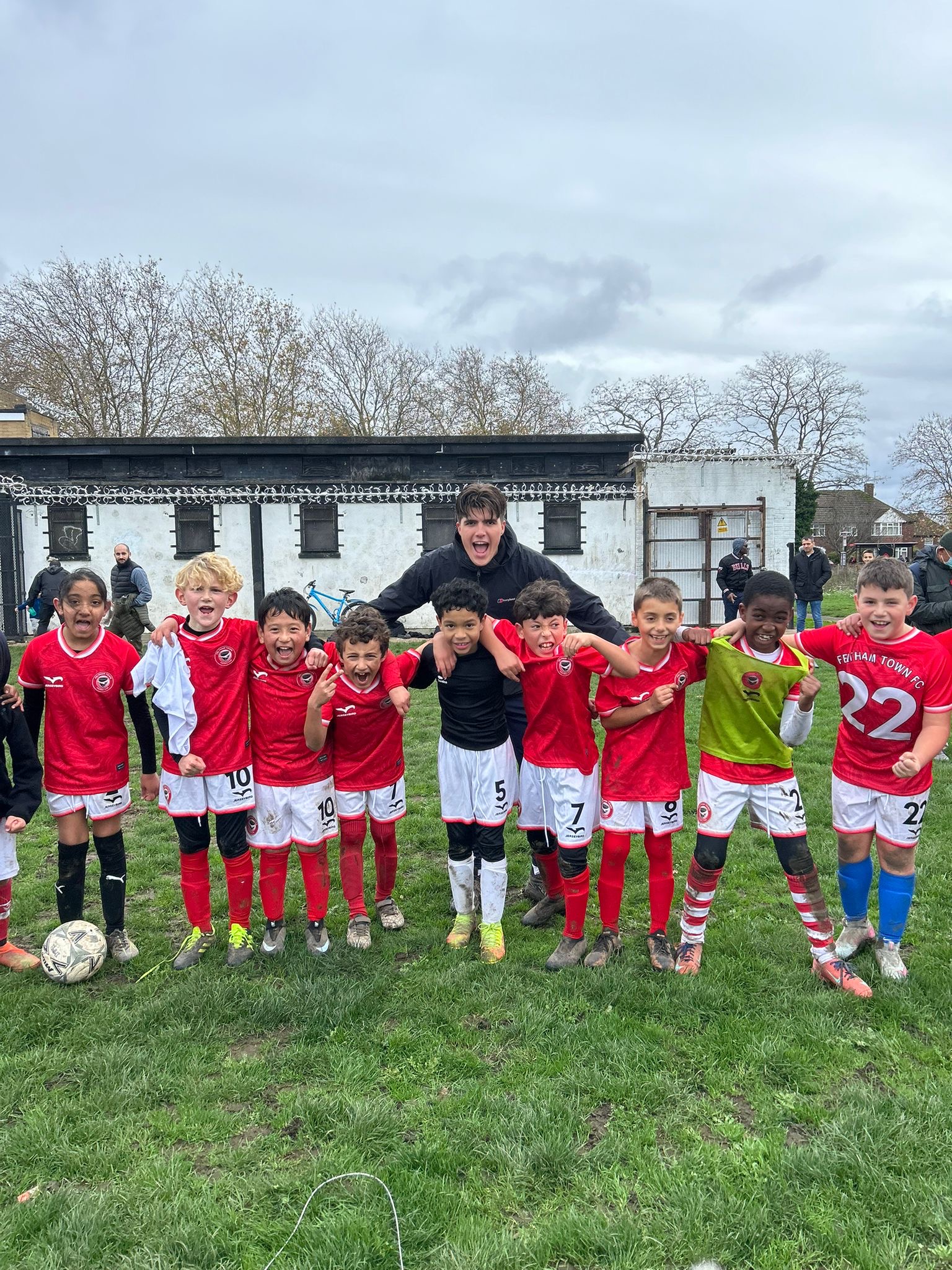 Feltham Town FC players supporting each other during a match